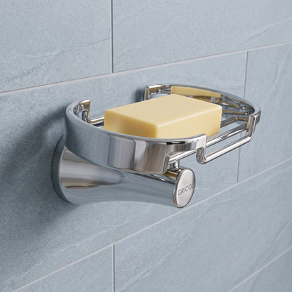 Jabonera rejilla Contempra en acabado cromado, instalada en un ambiente de baño moderno con un jabón.