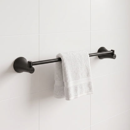 Toallero de barra Contempra en negro mate para baño, instalado en muro cerámico blanco.